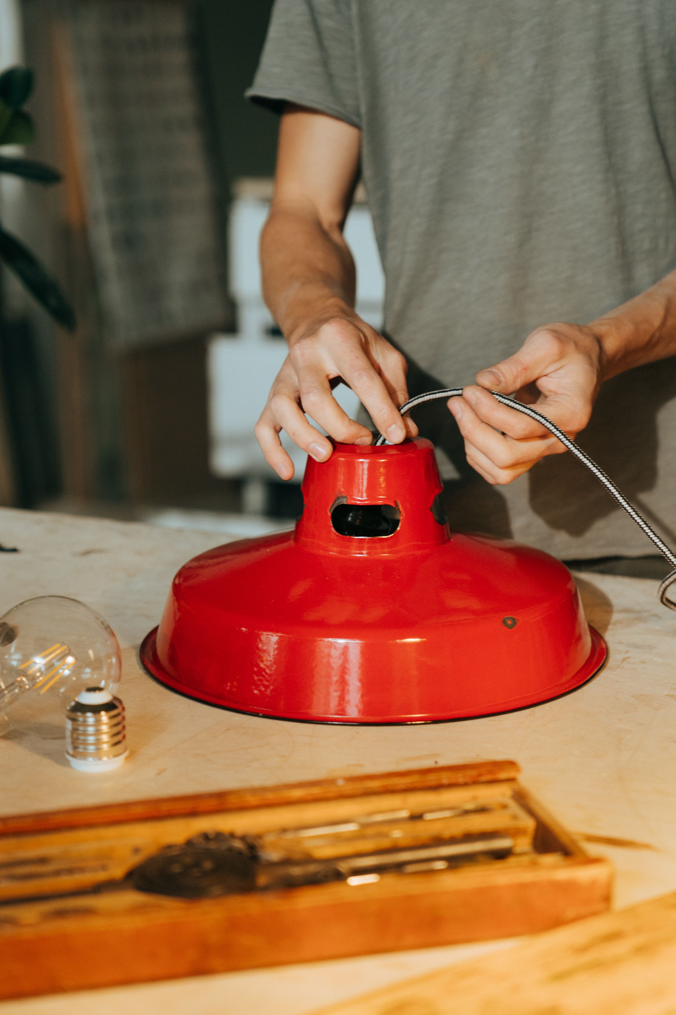 Electrician repairing a light fixture